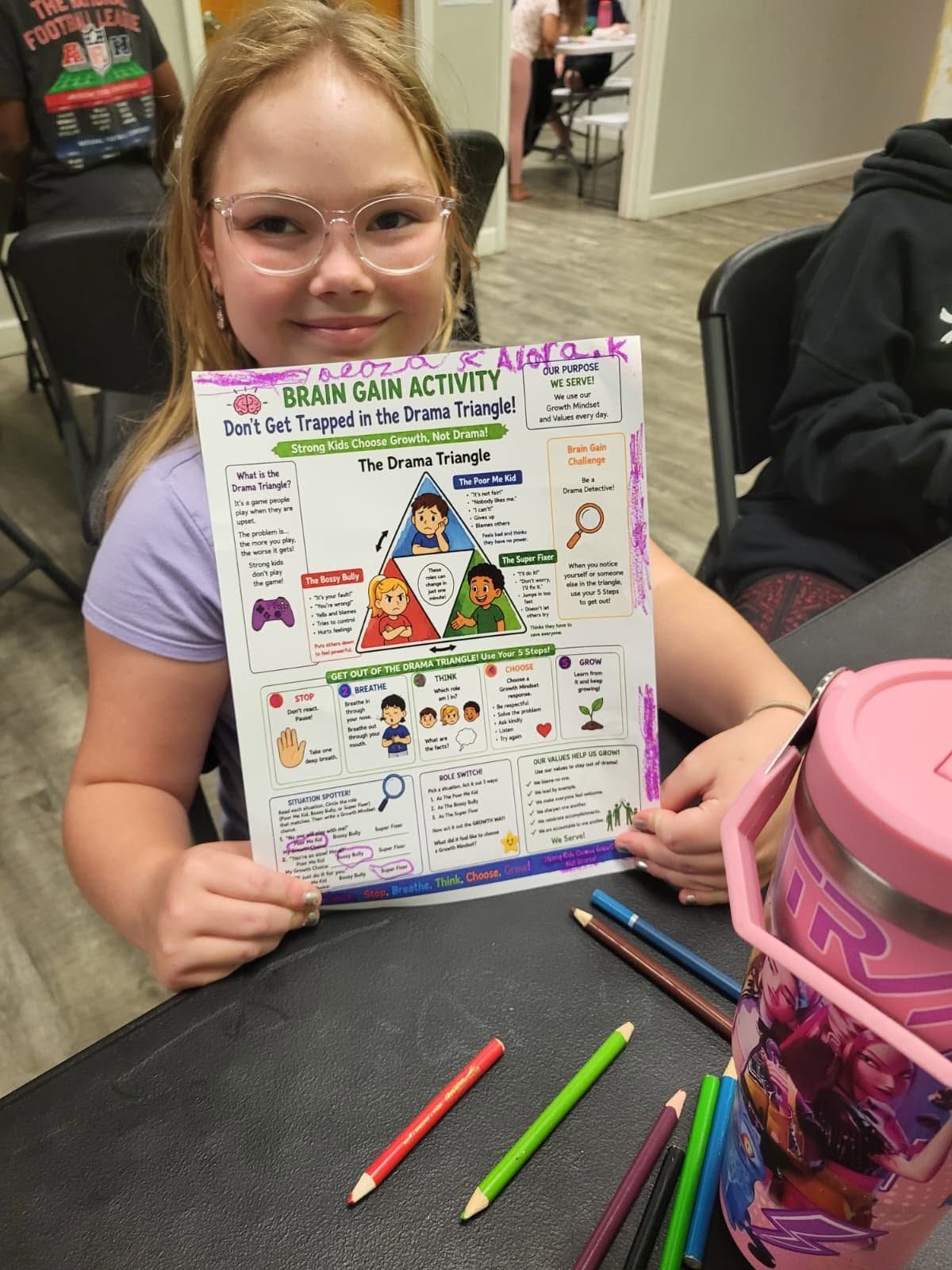After-School student holding a Brain Gain Growth Mindset activity