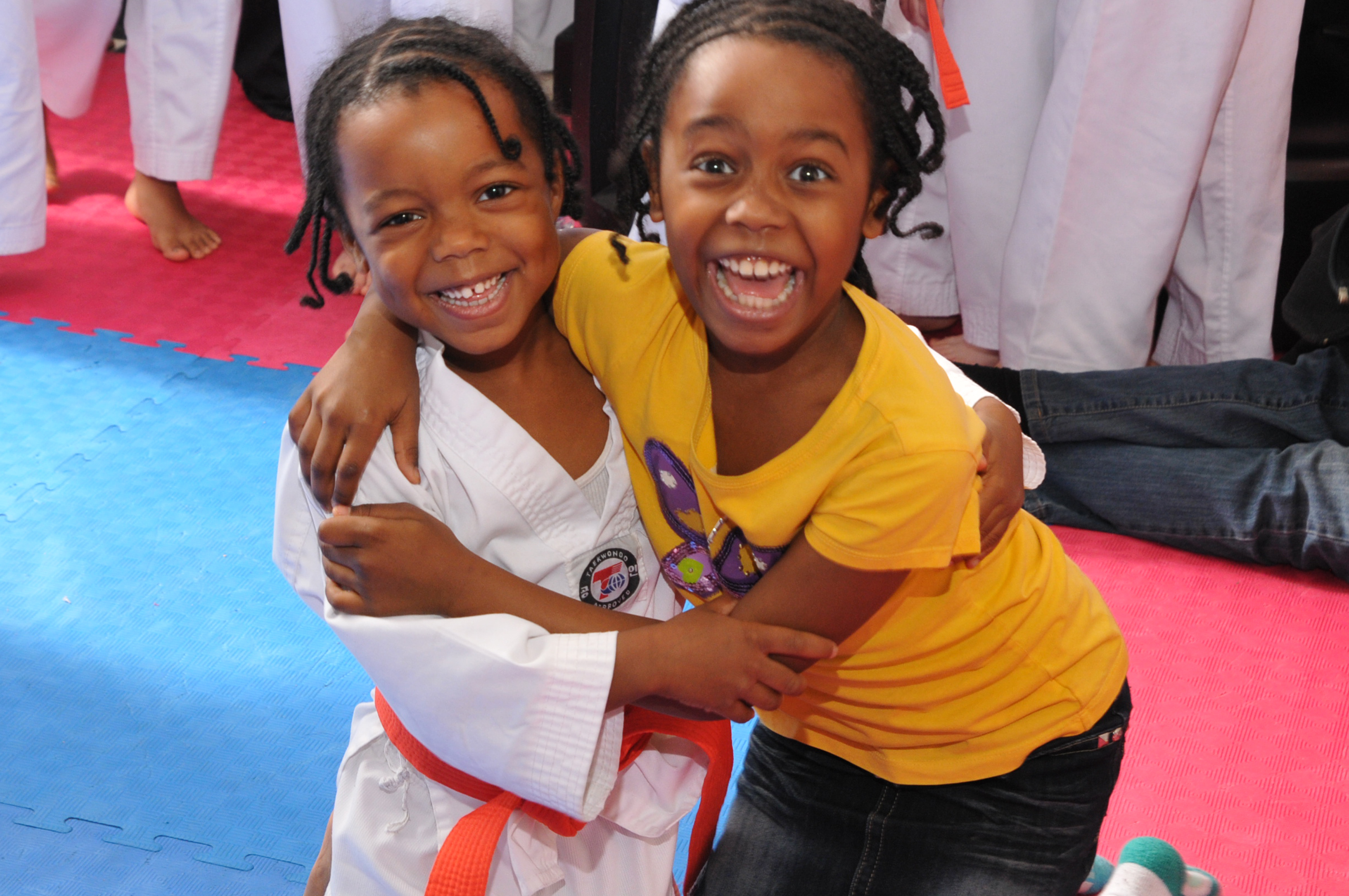 Students sharing a positive martial arts community moment