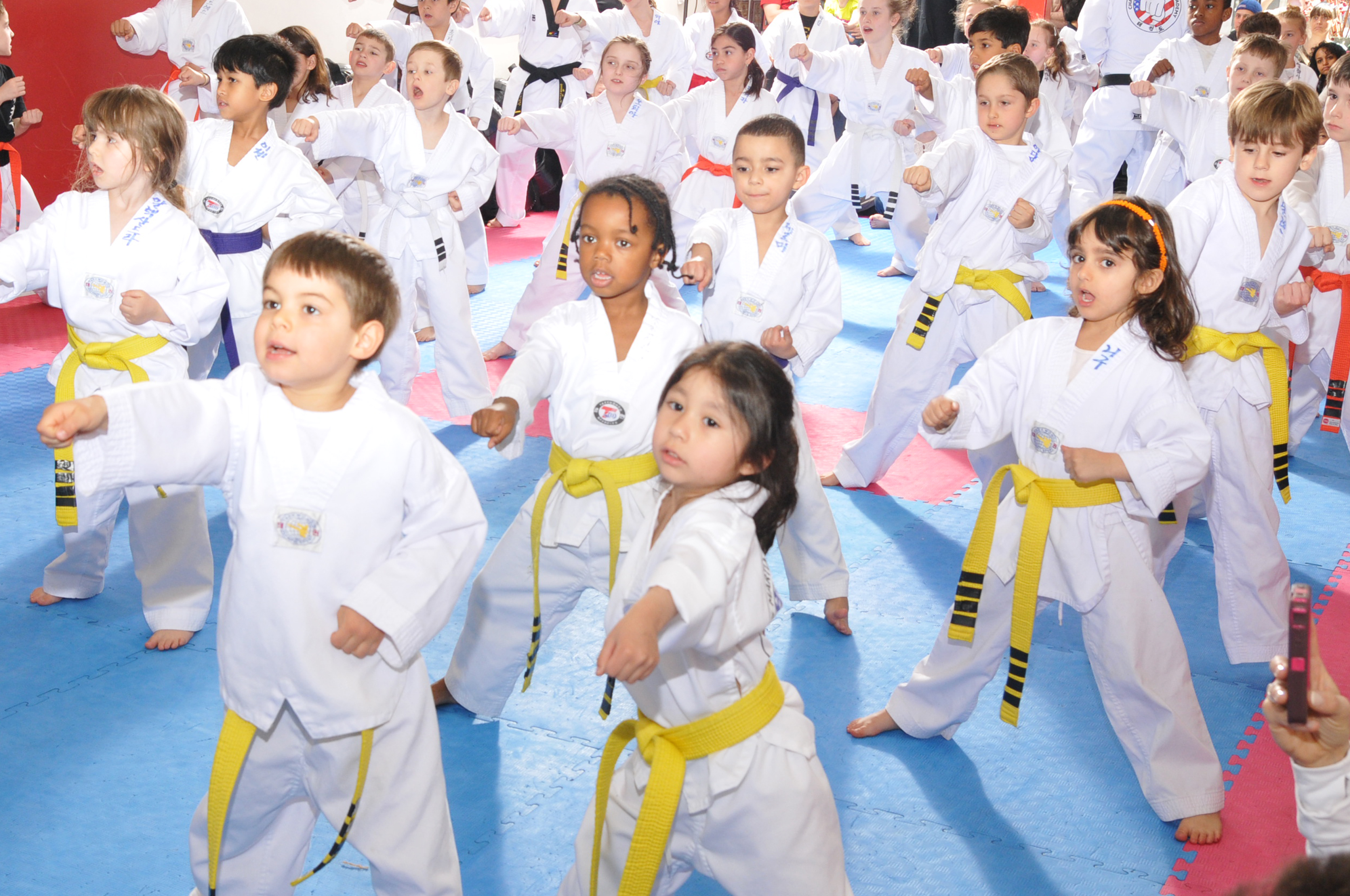 Children participating together in martial arts class