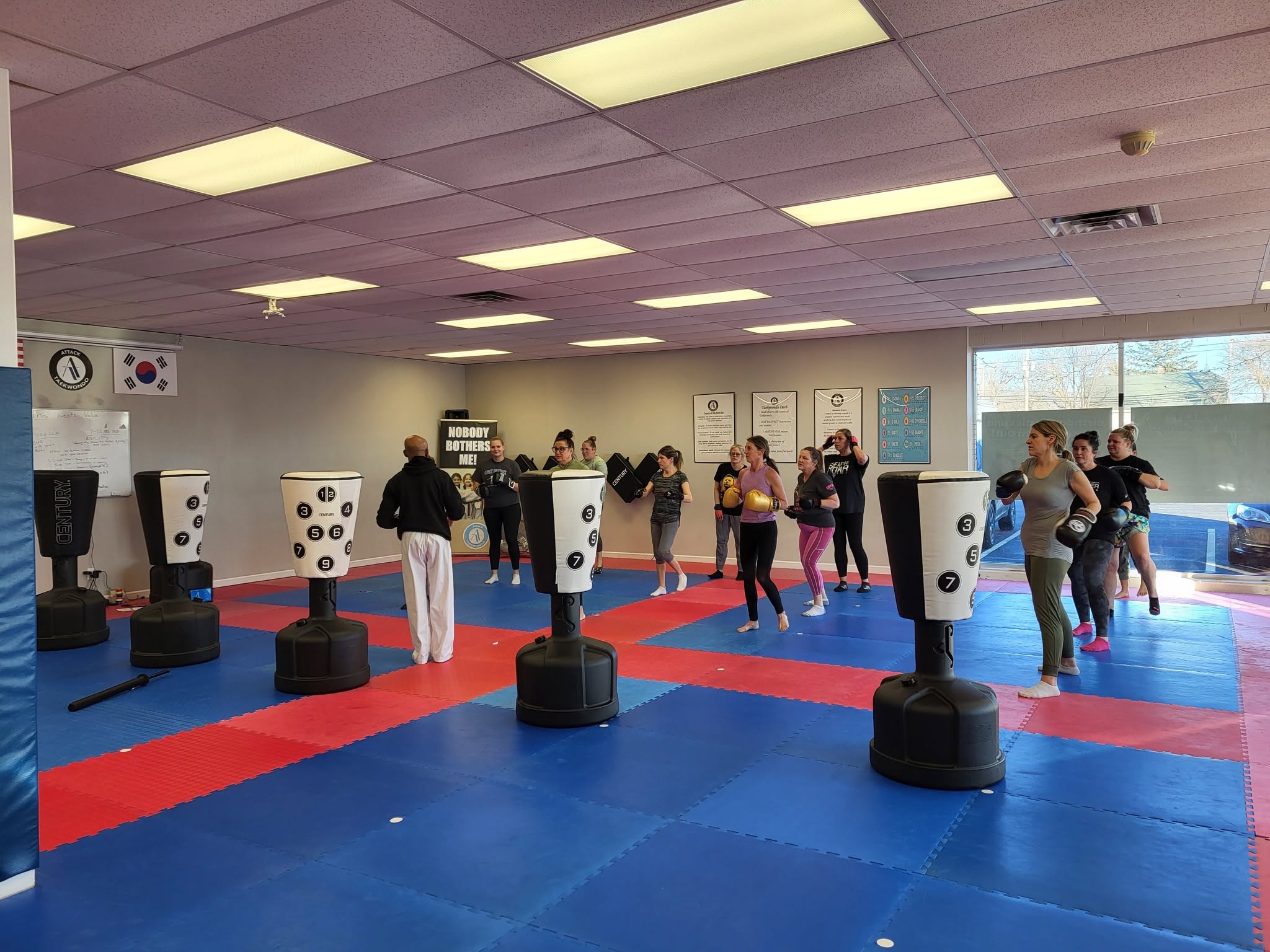 Real Turbulence Fitness Kickboxing members training on heavy bags