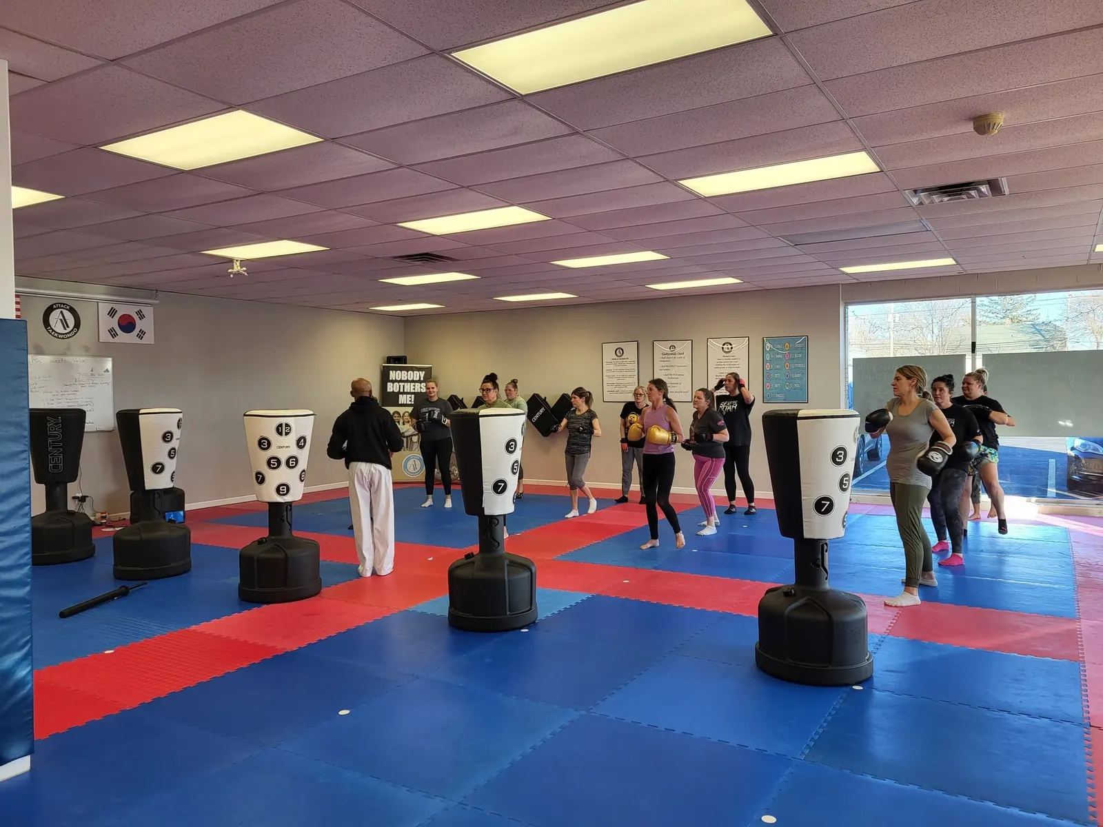 Real Turbulence Fitness Kickboxing members training on heavy bags